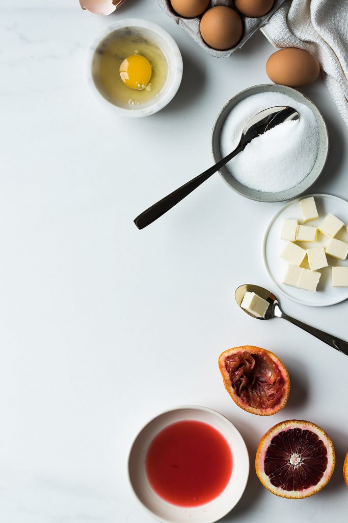 Shot of ingredients for blood orange curd.