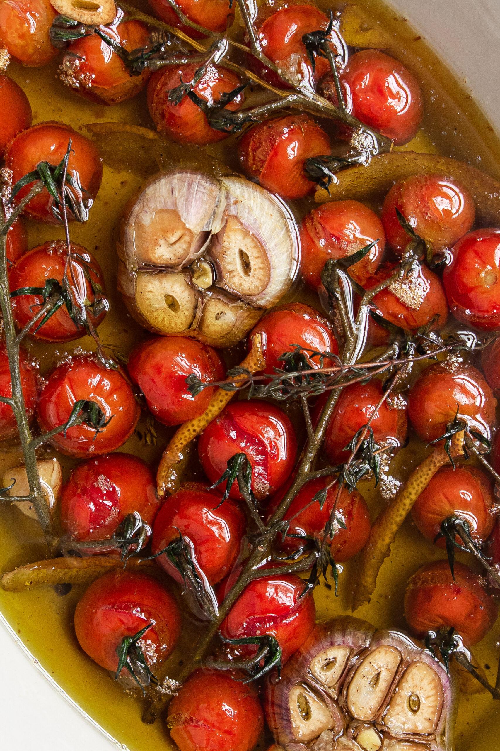 Cherry tomatoes confit with garlic and lemon peels.