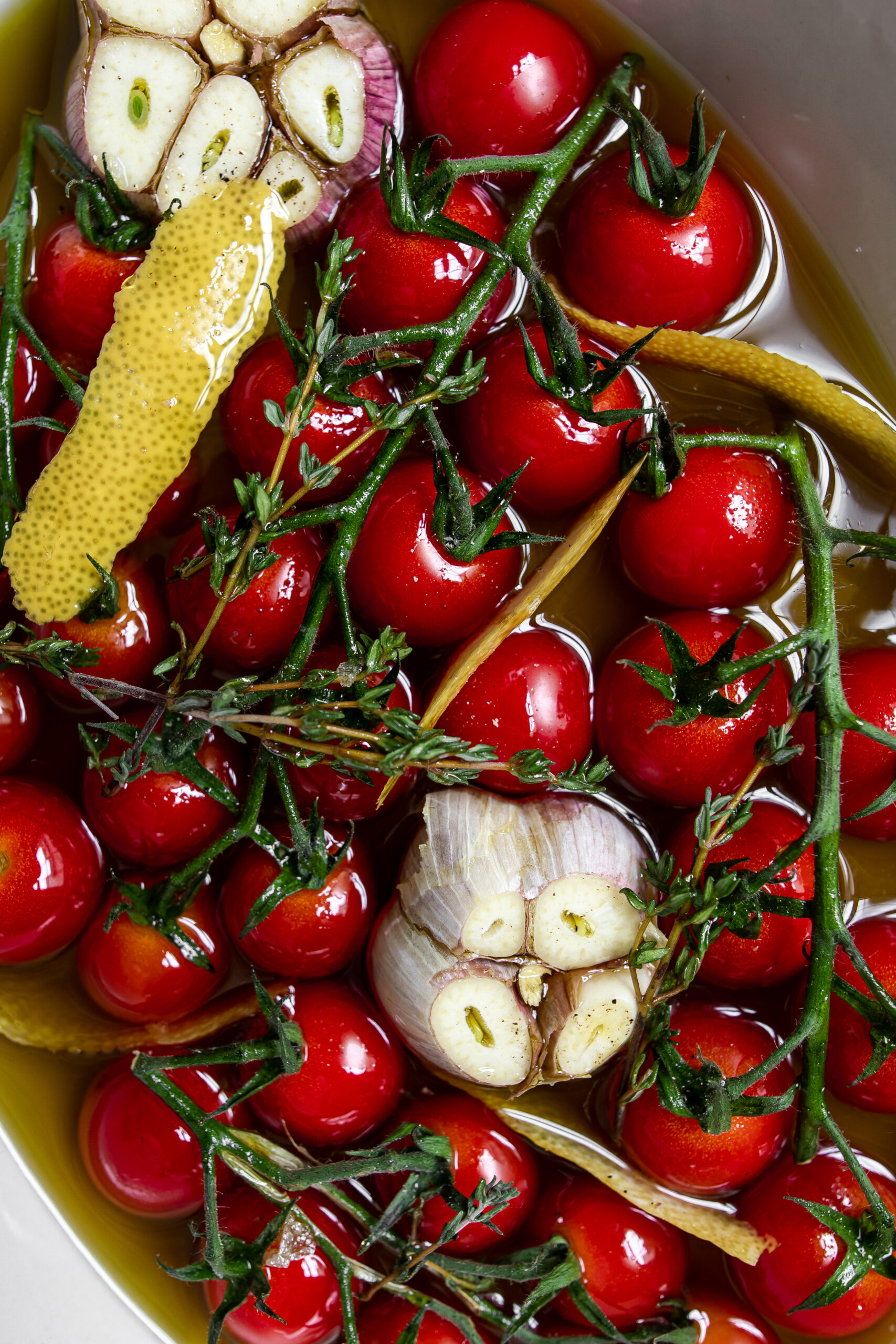 Fresh tomatoes, lemon peel, and garlic in olive oil.
